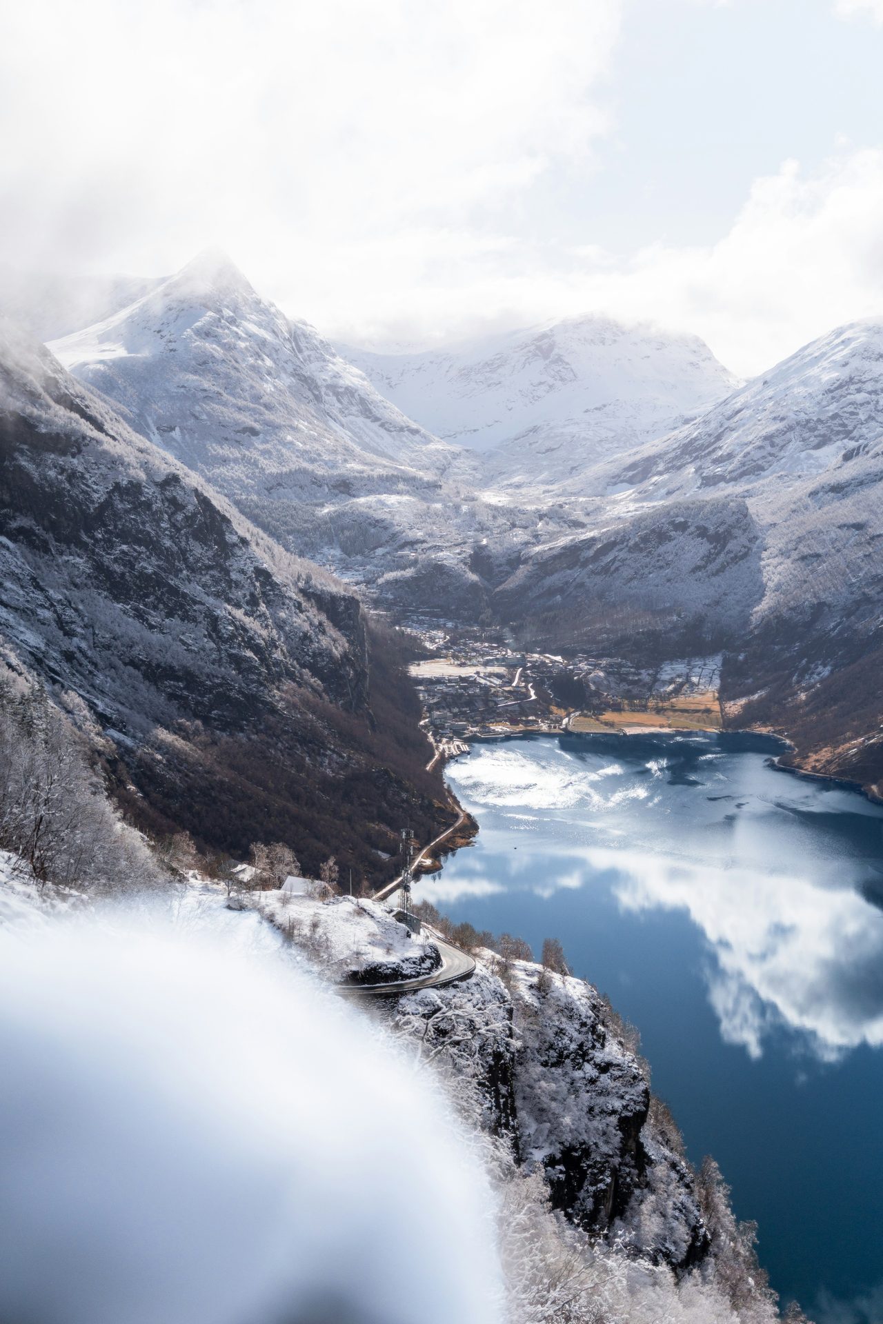 A Norwegian fjord with snow-capped mountains